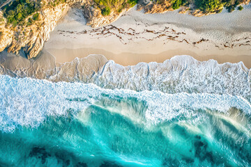 Aerial view of waves rolling on the shoreline.