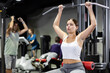 © JackF - Woman is engaged in a simulator for the development of back muscles