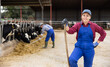 © JackF - Portrait of confident successful european female farmer posing in cowshed