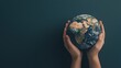 © pattaphorn - Hands Holding Earth Against Dark Background