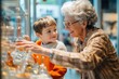 © kitipol - High-resolution brightly lit photorealistic candid photograph of a grandmother and grandchild having a delightful time at a local science museum, interacting with engaging exhibits and sharing