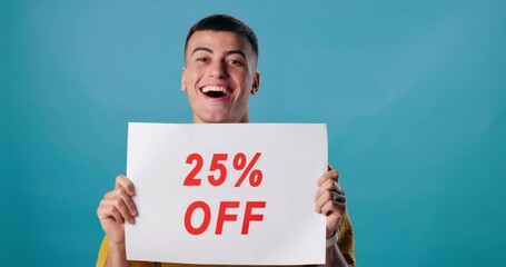 Canvas Print - Poster, discount and face of man in studio for percent off promotion, information and sign. Happy, advertising and portrait of person with banner for retail sale, deal and bargain on blue background