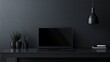 © pinporn manosri - Sleek, glossy black laptop on a minimalist desk setup with clean, modern design elements.