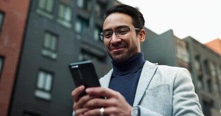 Wall Mural - Business, Asian man and laugh outdoor with texting on smartphone for social media in New York. Male person, from below and happy with browsing internet for entertainment, networking or communication