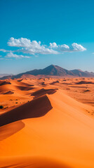 Vast desert landscape stretches with rolling sand dunes under a bright blue sky with fluffy white clouds.