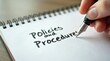 © vitanovski - Policies and procedures memo written on notebook with fountain pen
