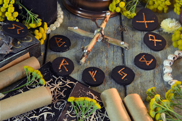 Wall Mural - Mystic still life with old scrolls, black runes and witchy ritual objects on wooden altar table. Occult, esoteric, wicca, Halloween and gothic concept.