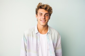 Poster - A young man with a smile on his face is wearing a white shirt