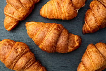 Group of sweet croissant . French morning breakfast . Top view