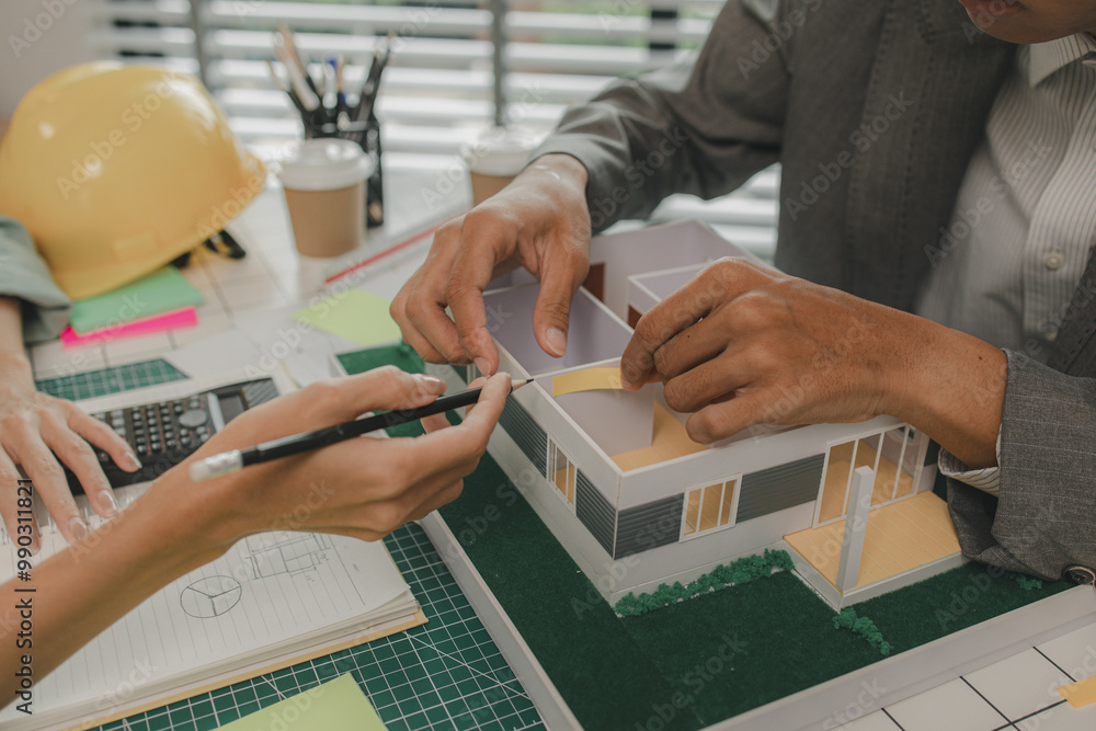 engineer and investor are negotiating the details of a housing project ...