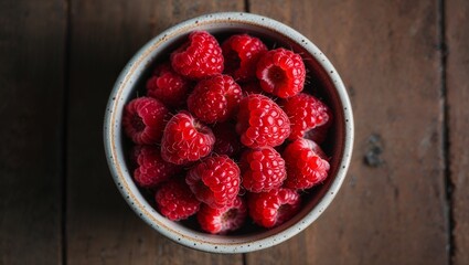 Poster - Ripe raspberries in a ceramic bowl closeup