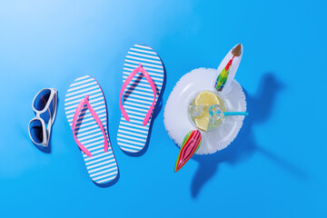 Poster - A vibrant summer vacation scene with flip flops, and a floating flamingo