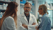 © SS Digital - Doctors talking to pharmaceutical sales representative, presenting new pharmaceutical product. Hospital manager talking with doctors team