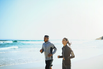 Canvas Print - Outdoor, running and couple with fitness at beach for morning cardio, endurance and training together. Man, woman and workout by water in nature for summer exercise, wellness and sports on weekend