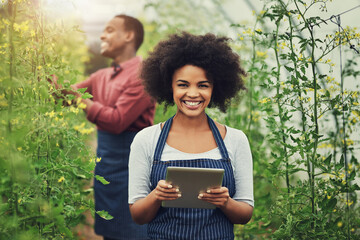 Happy woman, portrait and agriculture with tablet in greenhouse for crops, harvest or natural conservation. Young, female person or farmer with smile on technology for fresh produce or production