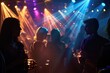 © dashtik - Vibrant Party Atmosphere with Colorful Lights and Blurred Crowd in Nightclub