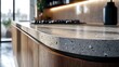 © Jack - A close-up shot of a kitchen countertop with a curved matte white laminate surface, highlighting the precision of the design