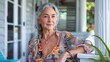 © AIGen - Mature Woman At Home. Stylish Interior Designer with Grey Hair Enjoying Leisure on Front Porch