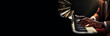 © Alberto Masnovo - Extreme close-up of the hands of an African-American male pianist playing a piano keyboard with great passion on a dark black background with copy space. Siede view. Generative Ai.