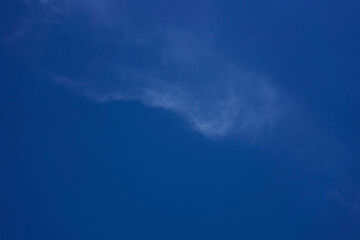 the sky on a summer day with white cirrus clouds