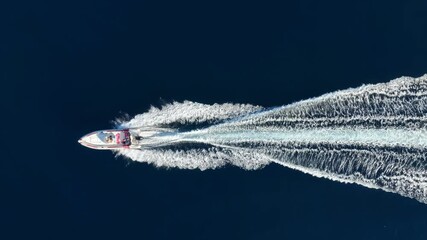 Wall Mural - aerial overhead view of a rib boat with outboard engine crossing the blue ocean with speed