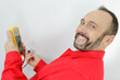 © auremar - happy electrician checking socket voltage
