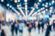 © Artstudio - Blurred figures at a trade show in an exhibition hall Concept for international events and marketing