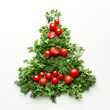 © eshana_blue - Christmas tree shape made from fresh dill, parsley and cherry tomatoes, promoting healthy eating during the holidays