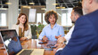 © PeopleVideos - Business team having a meeting at the boardroom