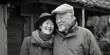 © vefimov - Lovely elderly Asian couple sharing affectionate embrace.