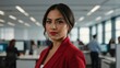 © Alteisen Riese - twenties hispanic woman in red attire on office background model portrait looking confident for ad concept space for text