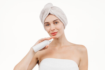 A portrait of a woman engaging with a cosmetic product mock-up. She exudes confidence, highlighting the significance of hydration and shine in her body and hair care routine.