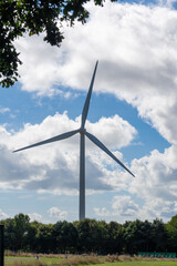 Wind turbine in rural Suffolk, UK,  generating electricity in eco-friendly way. Copy space.