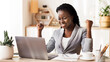 © Prostock-studio - Excited African American Businesswoman Celebrating Success, Looking At Laptop Screen And Shaking Fists At Workplace In Modern Office, Free Space