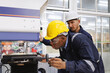 © gumpapa - head technician engineer consulting and discussing operations new machine technology to work in production line to factory worker. .