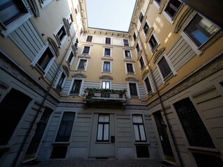 Canvas Print - Old residential building along via Biondi in Milan, Italy