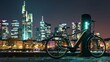 © VK Studio - An electric bike stands by a charging station, illuminated by the glowing city lights at night, symbolizing the fusion of sustainability and urban lifestyle.