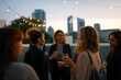 © Joaquin Corbalan - Business networking event at a rooftop bar during sunset with professionals enjoying drinks and engaging in conversation