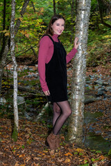 A young woman walking in the fall colors