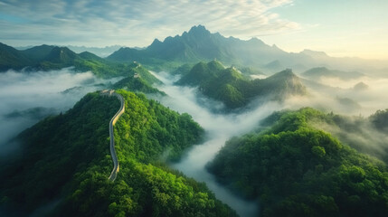 The Great Wall of China winding through the misty mountains under a clear blue sky