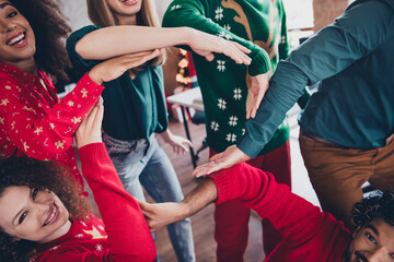 Wall Mural - Cropped photo of nice young people team employees team show circle enjoy cozy christmas decoration interior office indoors corporate party