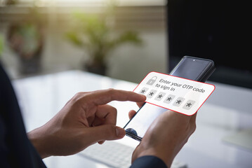 Leinwandbilder - person using a smartphone to enter a one time password (OTP) code for secure two factor authentication. data protection and secured internet access.