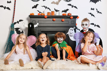 Poster - Funny children wearing costumes for Halloween celebration in decorated room