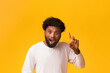 © Prostock-studio - Young african american man having idea, pointing finger up, suddenly got problem solution