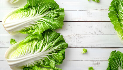 Wall Mural - Frame with fresh ripe leaves of Chinese cabbage on white wooden table, flat lay. Space for text