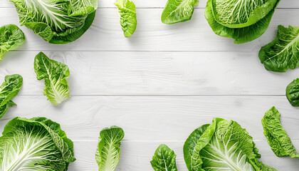 Wall Mural - Frame with fresh ripe leaves of Chinese cabbage on white wooden table, flat lay. Space for text