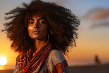 Poster - Portrait of a satisfied afro-american woman in her 20s dressed in a breathable mesh vest on stunning sunset beach background