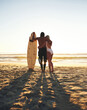 © StarDweller/peopleimages.com - Seaside, couple and hug with surfboard for love in bonding, break and memories in Australia. People, relationship and back view with sports for fitness, exercise and training with care and support