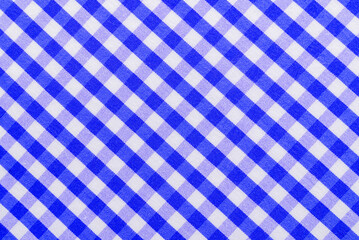 Wall Mural - Checkered blue fabric. Textile. Checkered fabric background with blue and white cells