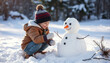 © STOCKIFY - adorable kid building a snowman